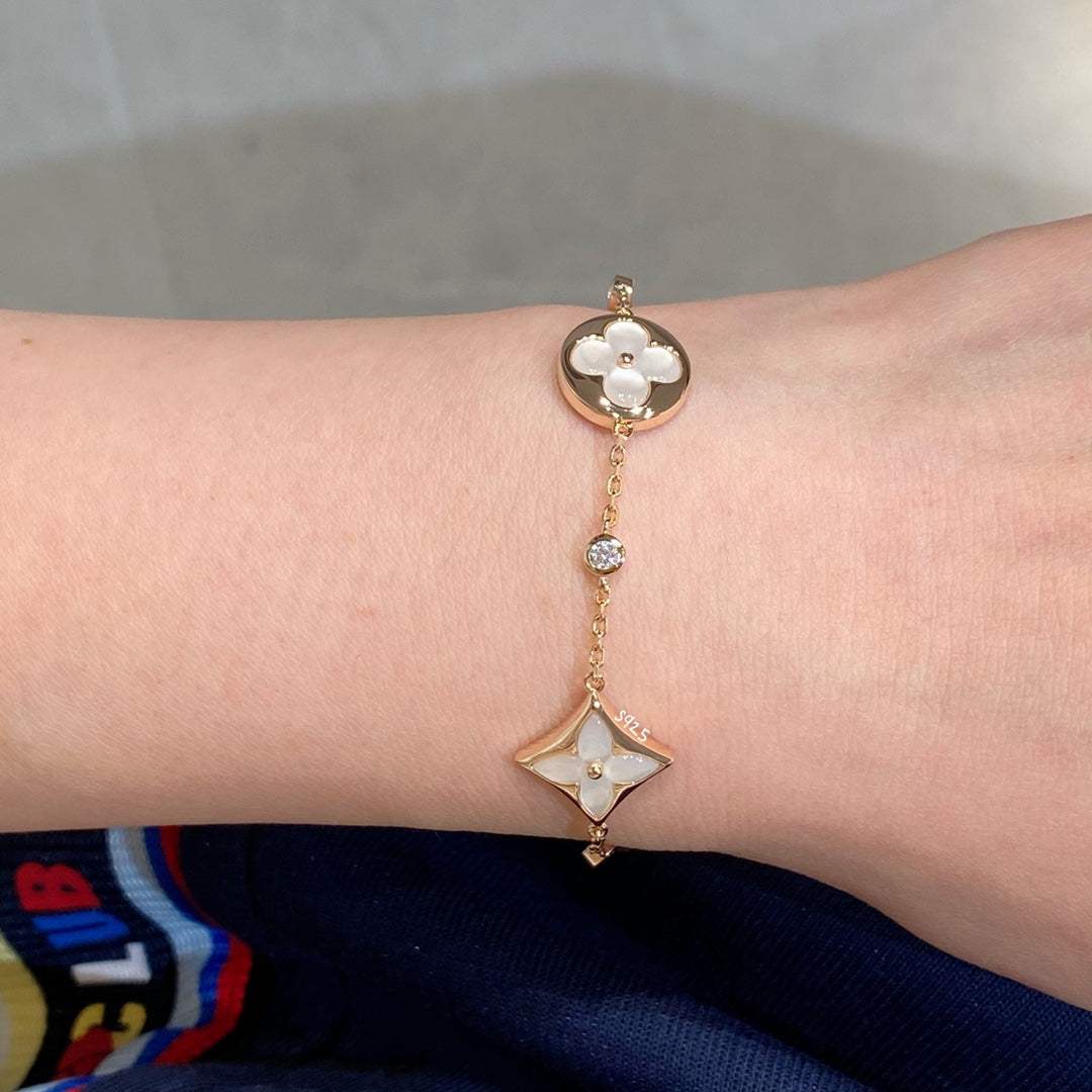 TimiSTAR AND SUN 4 MOTIF WHITE MOP PINK GOLD BRACELET