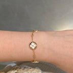 TimiSTAR AND SUN 4 MOTIF WHITE MOP PINK GOLD BRACELET