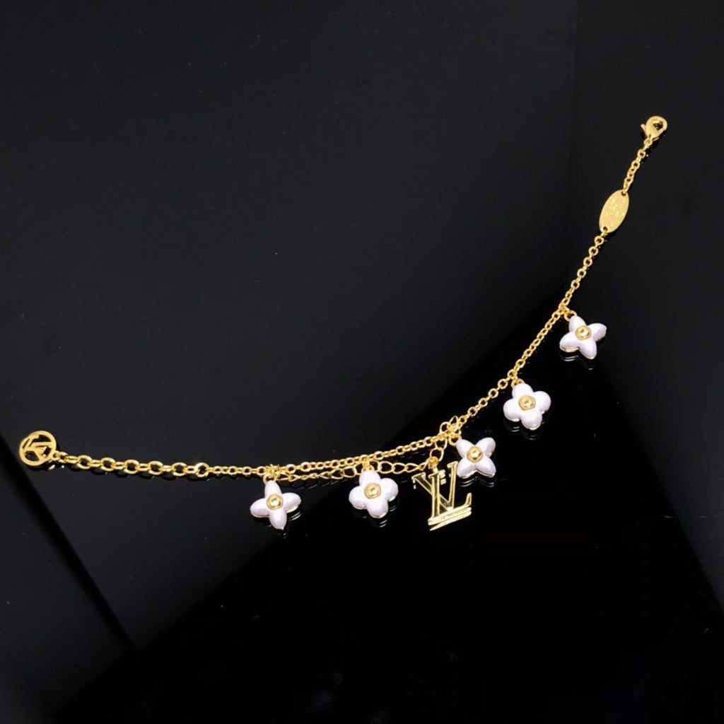 TimiLOGO 6 MOTIF STAR AND SUN GOLD BRACELET