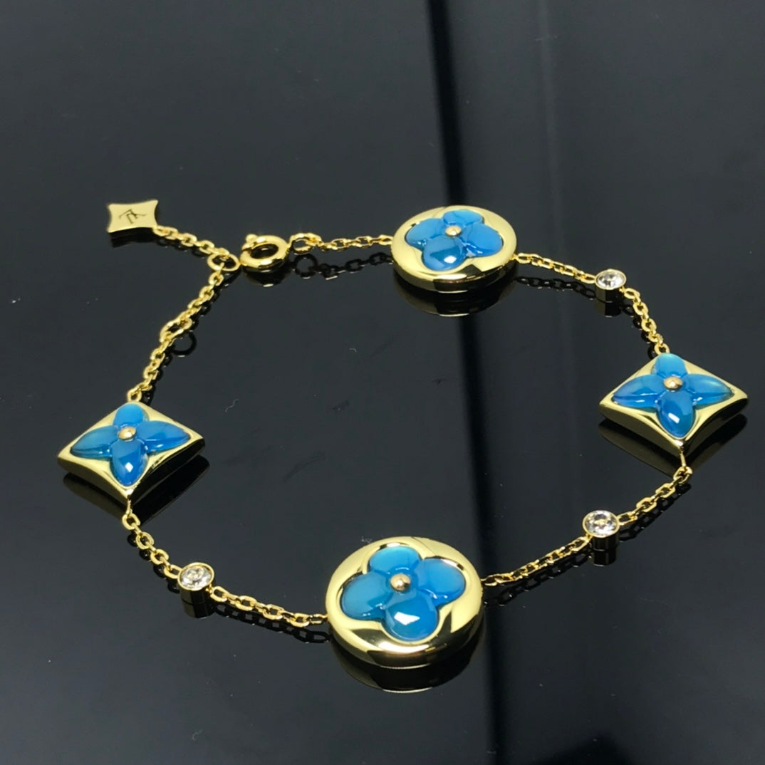TimiSTAR AND SUN 4 MOTIF BLUE BRACELET